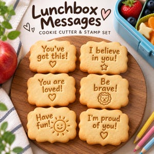 May include: Six rectangular biscuits with scalloped edges, each featuring embossed text and icons. The text reads: You've got this!, I believe in you!, You are loved!, Be brave!, Have fun!, and I'm proud of you!. The set is labelled Lunchbox Messages.
