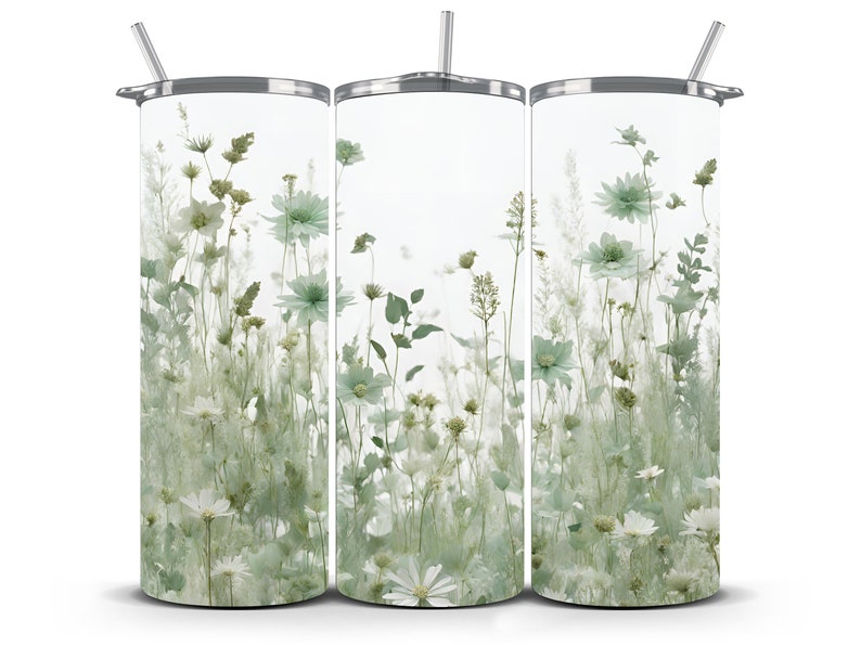 May include: Three stainless steel tumblers with a white background and a design of green and white pressed flowers.
