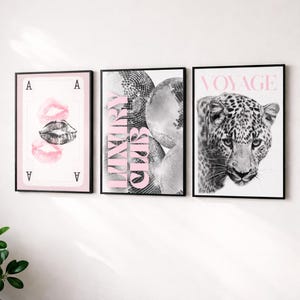 May include: Three framed art prints. The left print features a playing card with pink lips. The center print has disco balls and the text "LUXURY CLUB" in pink. The right print shows a black and white leopard with the word "VOYAGE" in pink.