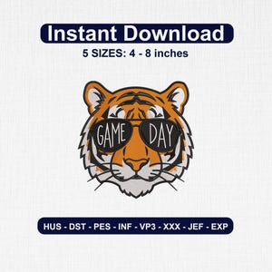 May include: An embroidery design featuring a tiger head wearing sunglasses with the text GAME DAY printed on the lenses. The design includes the text Instant Download, 5 SIZES: 4 - 8 inches, and file formats HUS, DST, PES, INF, VP3, XXX, JEF, and EXP.