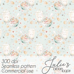 May include: Seamless pattern featuring bowls of colorful cereal, glasses of milk, and donuts on a light blue background. The design includes floral accents and the text "300 dpi Seamless pattern Commercial use" and "Julie's bloomboops".