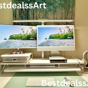 May include: A white ceramic mug with a black handle and the text "But First, Coffee" in a bold, black font. The mug is set against a blurred background, suggesting a cozy setting.