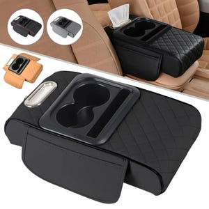 May include: Black car console with a quilted design, cup holders, and a tissue dispenser. Additional images show the console in different colours and styles. The console is designed to fit between the front seats of a car.