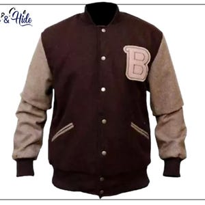 May include: A brown varsity jacket with tan sleeves and a black collar. The jacket features a large letter "B" patch on the chest and the text "Jack & Hide" in the upper left corner.