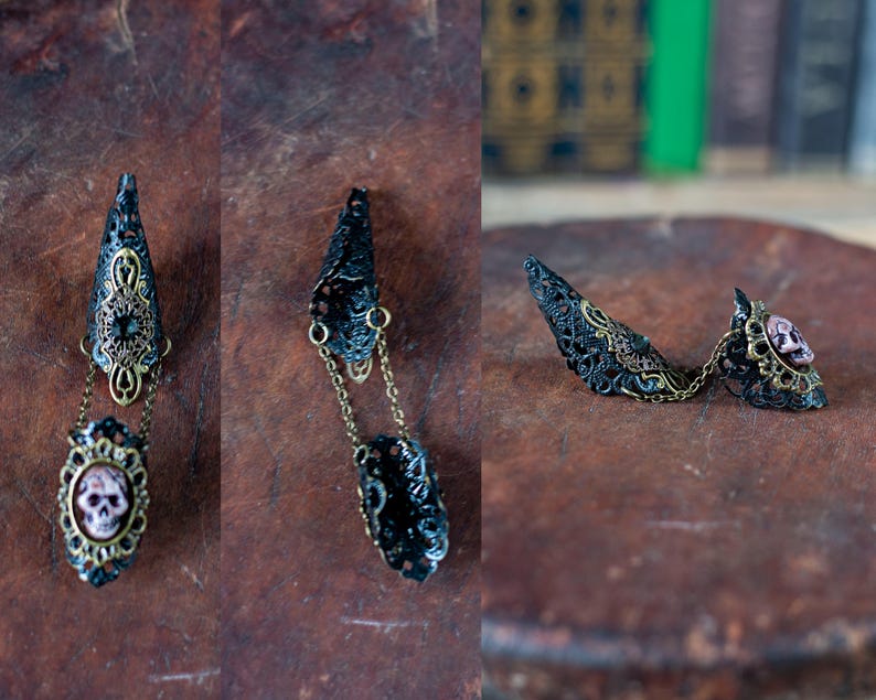 Detail shots of individual gothic claw rings showing construction.