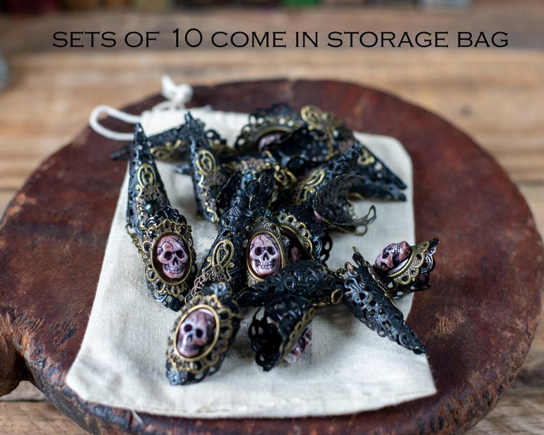 Set of 10 pirate nail claws displayed inside cotton storage bag.