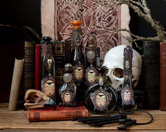 Raven Feathers (not actual raven feathers) Halloween Potion Bottle, Halloween Decor, Altered Art Glass Bottles, Wizard Potions, Witchcore