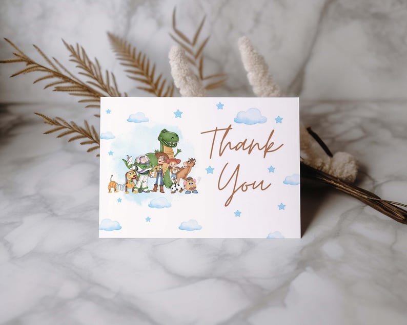 May include: A white card with a watercolor illustration of cartoon characters and the words "Thank You" in a brown script font. Blue stars and clouds decorate the background.