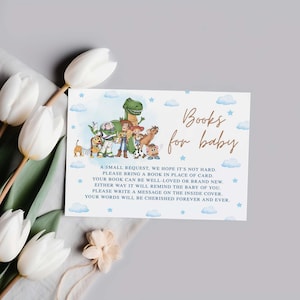 May include: A baby shower invitation card with the text "Books for baby" in gold script. The card features illustrations of characters from the Toy Story movie, with a blue watercolor background and white clouds.