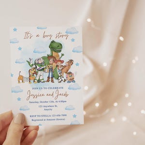 May include: A baby shower invitation card with a watercolor illustration of Toy Story characters, blue clouds, and stars. The text reads "It's a boy story" and invites guests to celebrate Jessica and Jacob.