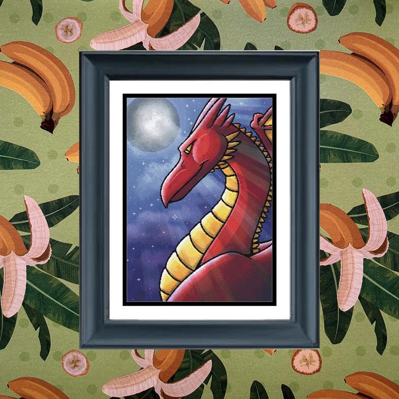 May include: A framed art print featuring a red dragon with yellow underbelly scales against a dark blue night sky with a full moon and stars. The artwork is enclosed in a black rectangular frame with a white mat border, centered on a background.