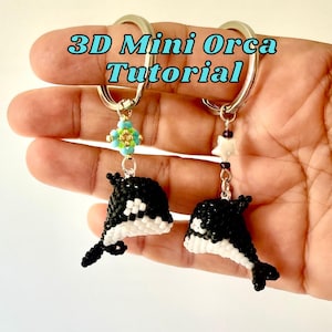 May include: Two keychains featuring 3D mini orca figures crafted from small black and white beads. The text 3D Mini Orca Tutorial is visible. One orca has a turquoise and lime green beaded accent, while the other features a white star-shaped bead.