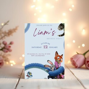 May include: A light blue birthday party invitation featuring the text "Liam's Birthday Party". The invitation includes cartoon characters and the date: Saturday, January 12th at 6:00 PM. The RSVP information is also included.