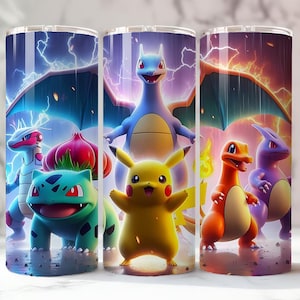 May include: Three stainless steel tumblers featuring colorful illustrations of various Pok&eacute;mon characters. The designs include Pikachu, Charizard, and Bulbasaur, set against a backdrop of lightning and flames. The tumblers are cylindrical and appear to be insulated.