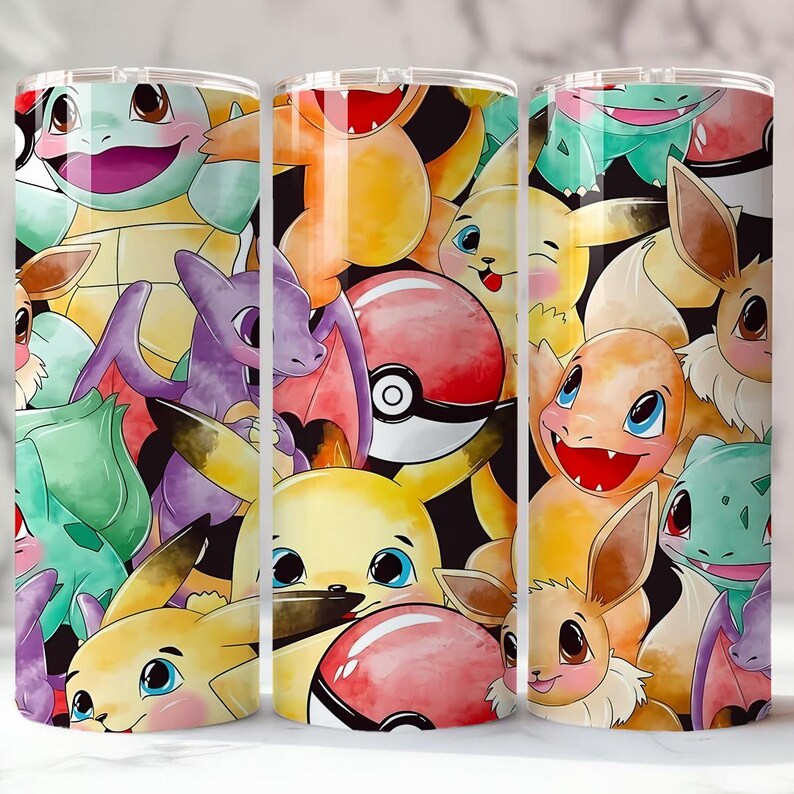 May include: A set of three stainless steel tumblers featuring a colorful collage of various cartoon characters. The design includes images of Pikachu, Charmander, Squirtle, and other characters on a black background.