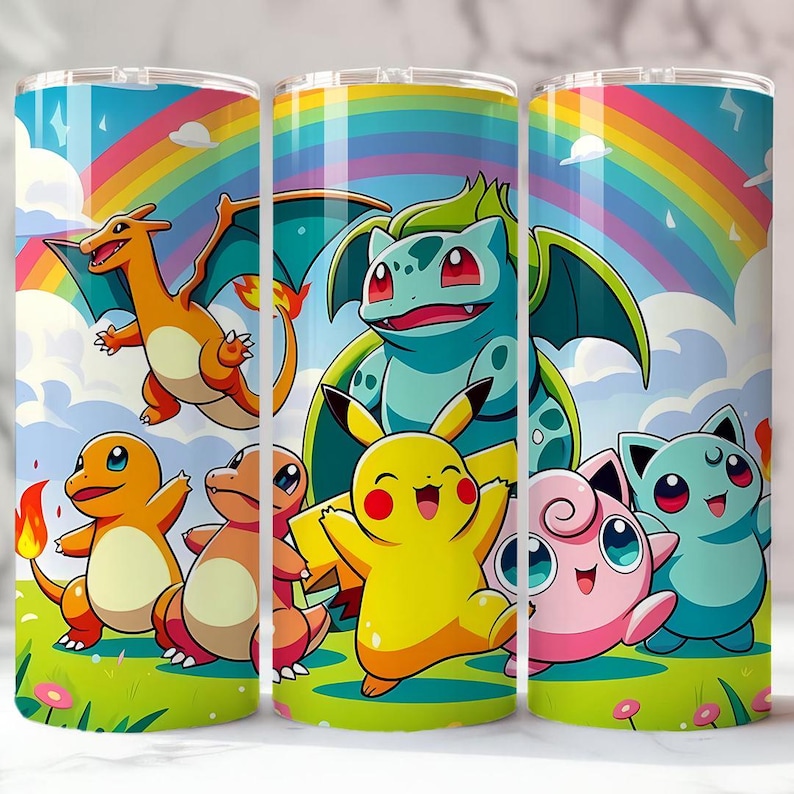 May include: A set of three stainless steel tumblers featuring colorful cartoon characters against a rainbow and cloud background. The characters include a yellow Pikachu, orange Charmander, and green Bulbasaur. The tumblers are designed for cold beverages.