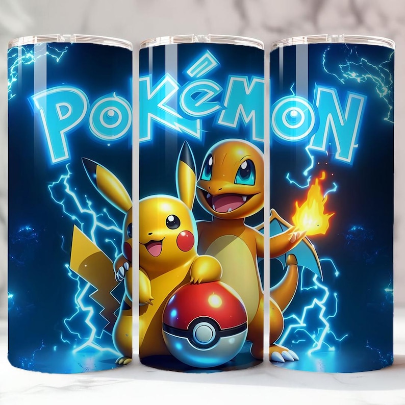 May include: A stainless steel tumbler featuring the word "Pok&eacute;mon" in bright blue, with Pikachu, Charmander, and a Pok&eacute; Ball against a dark blue background with lightning bolts. The design is vibrant and colorful.