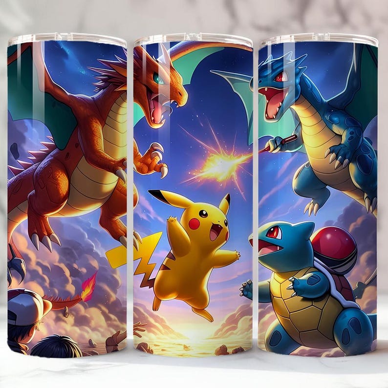 May include: Three stainless steel insulated tumblers with a colorful illustration of Pokemon characters. The design features a red dragon, a blue dragon, Pikachu, and Squirtle against a blue sky background.