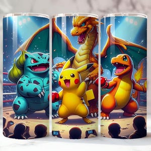 May include: Three stainless steel tumblers with a vibrant illustration of Pokemon characters in a boxing ring. The design features Bulbasaur, Pikachu, Charizard, and Charmander, all wearing boxing gloves. The background includes an audience and spotlights.