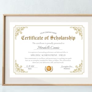 May include: A framed certificate of scholarship with gold text and decorative flourishes. The certificate includes the text "Certificate of Scholarship" and the recipient's name, Mirabelle Connie. The date is 12.09.2026.