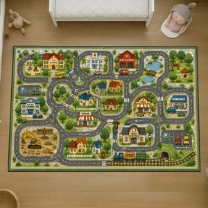 May include: A rectangular area rug featuring a detailed town map illustration with winding gray roads, green trees, and various buildings including a school, hospital, fire station, police station, store, cafe, and train station with a train.