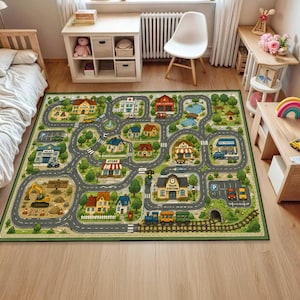 May include: A rectangular area rug featuring a colorful illustrated town map with winding roads, various buildings like a school, hospital, fire station, and train station, green trees, a construction site, and a train track with a train.
