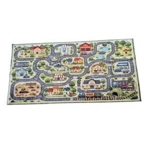May include: A rectangular play rug featuring a colorful illustrated town map with roads, trees, and buildings labeled as school, hospital, fire station, store, cafe, train station, and gas station. The scene includes a construction site and a train track.
