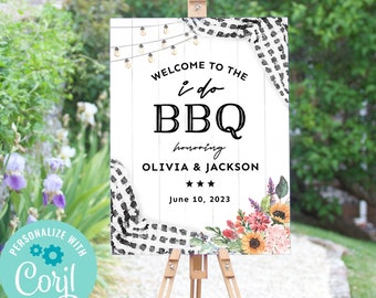 May include: A white sign with a black and white checkered pattern at the top. The sign says "Welcome to the i do BBQ honoring Olivia & Jackson June 10, 2023".
