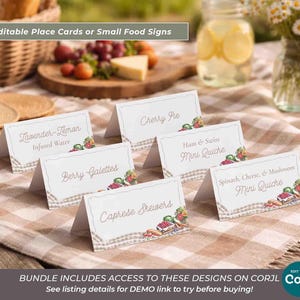 May include: White place cards with food names like "Berry Galettes" and "Spinach, Cheese, & Mushroom Mini Quiche" are arranged on a checkered tablecloth. The cards have decorative borders and illustrations of food. Text at the top reads "Editable Place Cards or Small Food Signs."