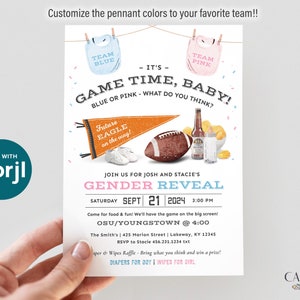 May include: A gender reveal party invitation with a football, pennants, and baby bibs. The invitation says "Game Time, Baby!" and asks "Blue or Pink - What do you think?" The invitation is for a party on September 21, 2024, at 3:00 PM. The party will be held at the Smith's, 425 Marion Street, Lakeway, KY 12345. RSVP to Stacie at 456.231.1234.