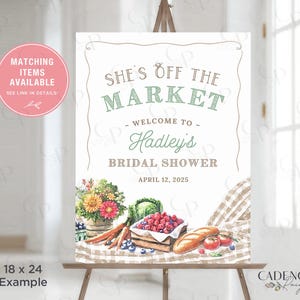May include: A bridal shower sign on an easel. The sign reads "She's Off The Market" and welcomes guests to Hadley's Bridal Shower on April 12, 2025. The sign is 18 x 24 inches and features watercolor illustrations of flowers, vegetables, and fruit.