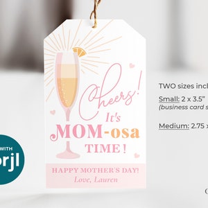 May include: Pink and orange printable gift tag with a glass of champagne, the text "Cheers! It's Mom-osa Time!" and the message "Happy Mother's Day! Love, Lauren". Two sizes are included: 5.1 x 8.9 cm (business card size) and 7 x 12.1 cm.