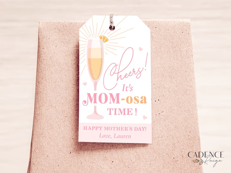 May include: A pink and orange gift tag with a glass of mimosa and the text "Cheers! It's Mom-osa Time! Happy Mother's Day! Love, Lauren"