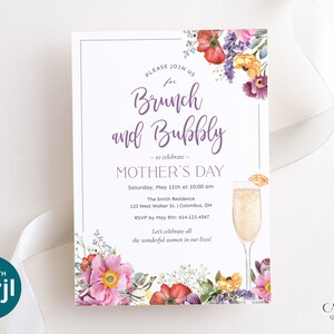 May include: A white invitation card with a floral design and text that reads "Please join us for Brunch and Bubbly - to celebrate - Mother's Day". The invitation includes details for the event, including the date, time, location, and RSVP information.