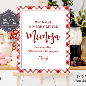 May include: Printable 8x10 inch PDF sign with a red and white buffalo plaid background. The sign says "Have Yourself A Merry Little Mimosa" and includes instructions to "Pour some bubbly. Splash with juice. Top with fruit. Cheers!"