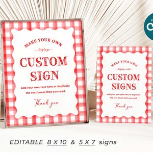 May include: Two editable signs with a red and white gingham pattern. The larger sign says "Make your own - displays - Custom Sign" and the smaller sign says "Make your own - displays with - Custom Signs". Both signs have the text "Add your own text here or duplicate the text boxes that you need. Thank you".
