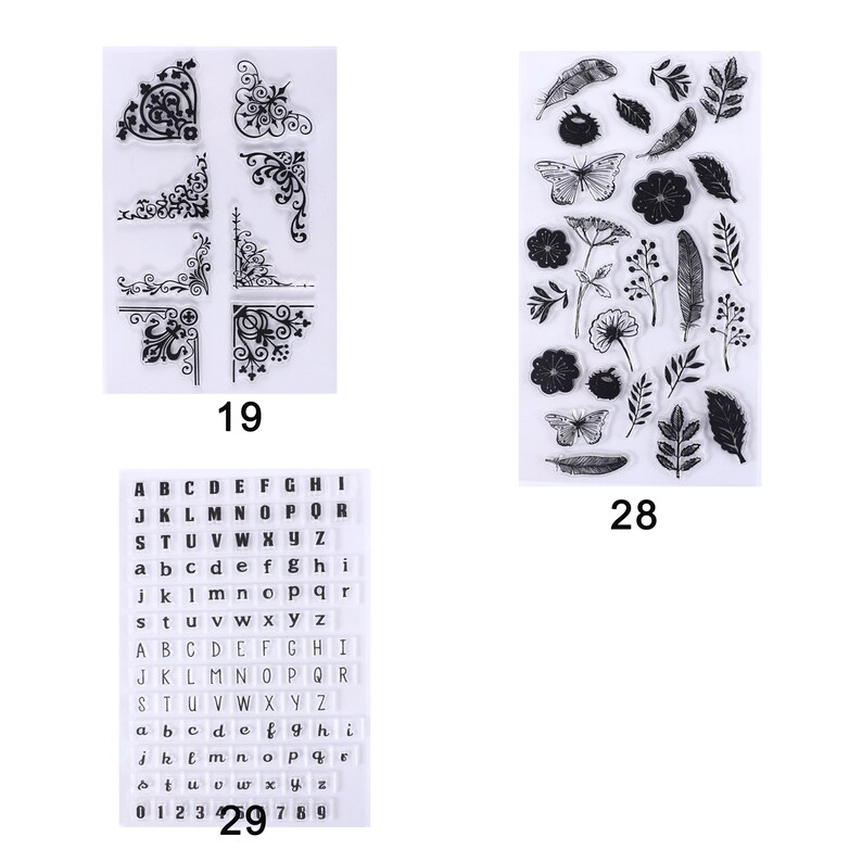 May include: Clear stamps with decorative corner designs, floral and butterfly motifs, and alphabet letters and numbers. The stamps are labeled with the numbers 19, 28, and 29.