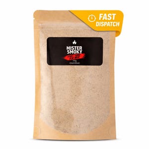 May include: A brown paper bag of Mister Smoky seasoning for meat. The black label features the brand name and product details. A yellow banner with "FAST DISPATCH" is in the upper right corner. The bag contains 110g of seasoning.