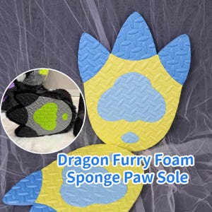 May include: Dragon Furry Foam Sponge Paw Sole in blue, yellow, and gray. The paw sole is shaped like a dragon's foot with a textured pattern. The image also includes a close-up of a furry paw.