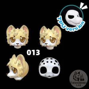 May include: Four stylized, cartoon-like animal heads in shades of tan and white, with large brown eyes. One head is a full mask with black spots. The number "013" is printed in white. A logo with a fox and text is in the bottom right.