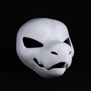 May include: A plain white mask in the shape of an animal's head, featuring large eye holes, a snout, and an open mouth. The mask is made from a smooth material and is designed to be worn. Suitable for costumes or cosplay.