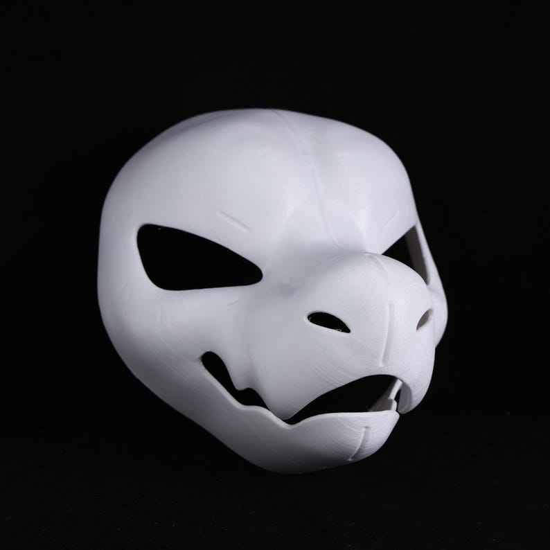 May include: A plain white mask in the shape of an animal's head, featuring large eye holes, a snout, and an open mouth. The mask is made from a smooth material and is designed to be worn. Suitable for costumes or cosplay.
