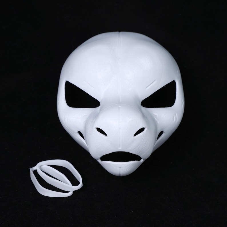May include: A white, 3D-printed mask with a stylized animal face. The mask has large, angular eye openings, a prominent snout, and small holes near the mouth. A white elastic band is included.