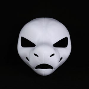 May include: A white mask with a reptilian or avian design. It has large, angular eye openings, a prominent snout, and a downturned mouth. The mask is made of a smooth material and is set against a black background. The mask is likely for cosplay.
