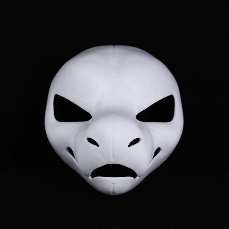 May include: A white mask with a reptilian or avian design. It has large, angular eye openings, a prominent snout, and a downturned mouth. The mask is made of a smooth material and is set against a black background. The mask is likely for cosplay.