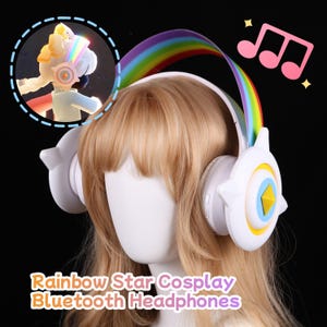 May include: White Bluetooth headphones with a rainbow arch and star-shaped accents. The headphones have a yellow and blue star design on the earcups. The text on the image reads "Rainbow Star Cosplay Bluetooth Headphones."