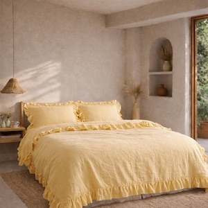 May include: A bed dressed with a yellow, ruffled duvet cover and pillowcases. The bed sits on a woven rug. The room has a neutral colour scheme and a woven pendant light.