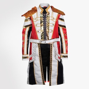 May include: A long-sleeved military-style jacket in red, white, and black with gold metallic accents. It features gold fringe epaulets, a central zipper, decorative gold cord loops, and vertical panels of white and black fabric with metallic trim.