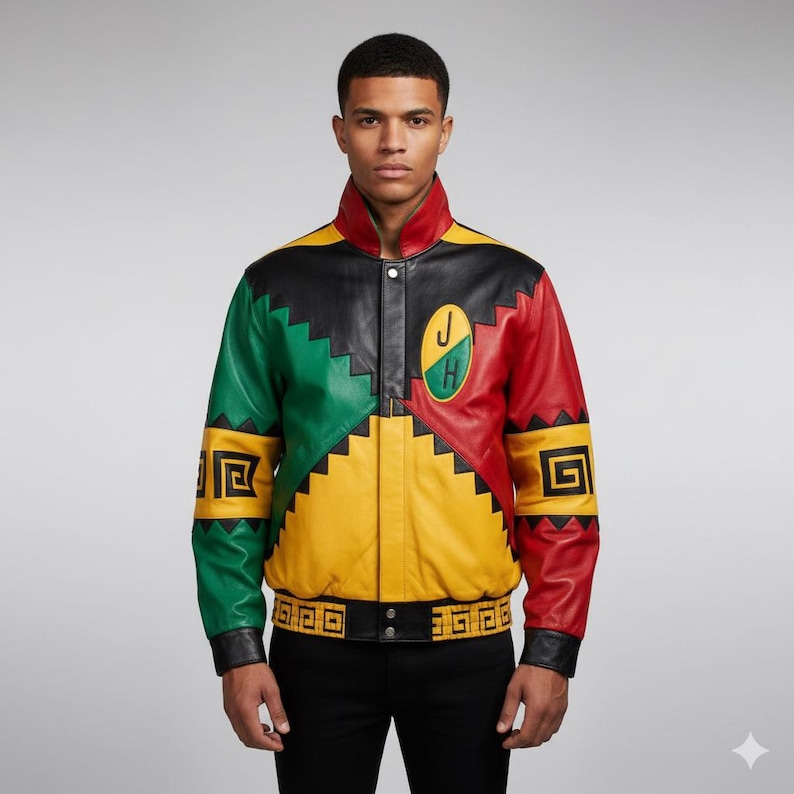 May include: A colourful leather jacket in black, green, yellow, and red. The jacket has geometric patterns, a collar, and a belt. The jacket features a patch with the letters "J" and "H".