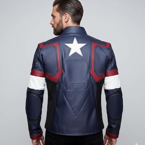 May include: A navy blue leather jacket with red and white accents, featuring a large white star on the back. The jacket has a stand-up collar and black mesh detailing on the sides and elbows. A superhero-themed garment.
